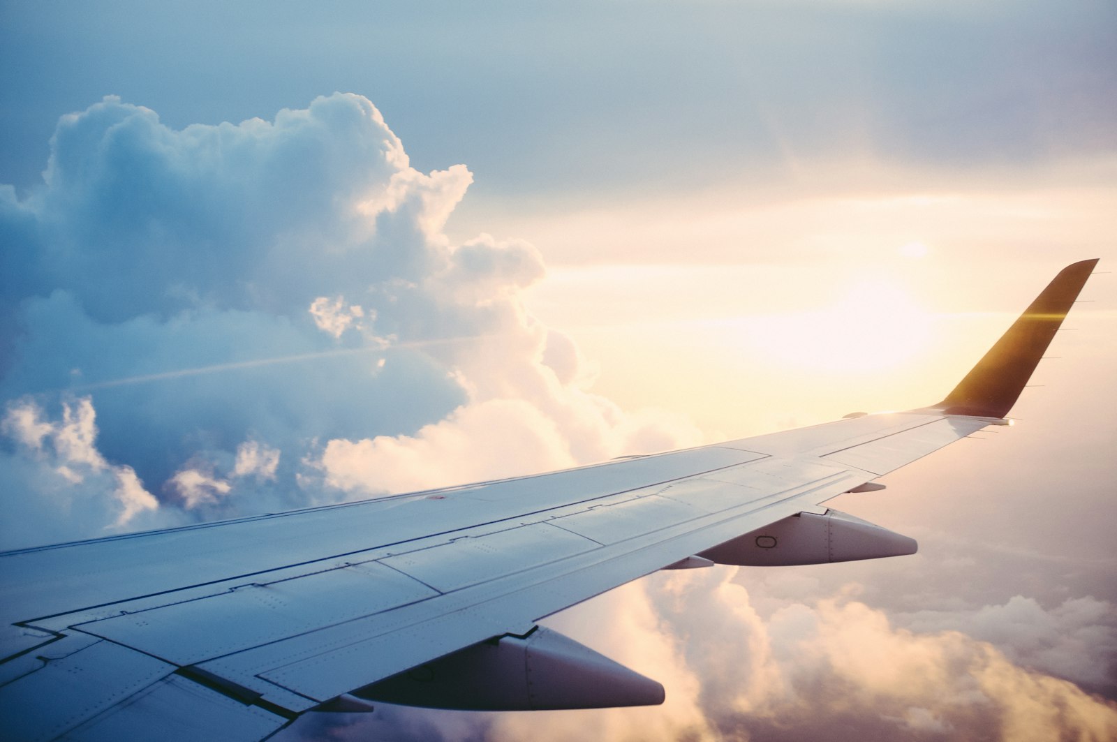 Airplane above clouds representing global Django development